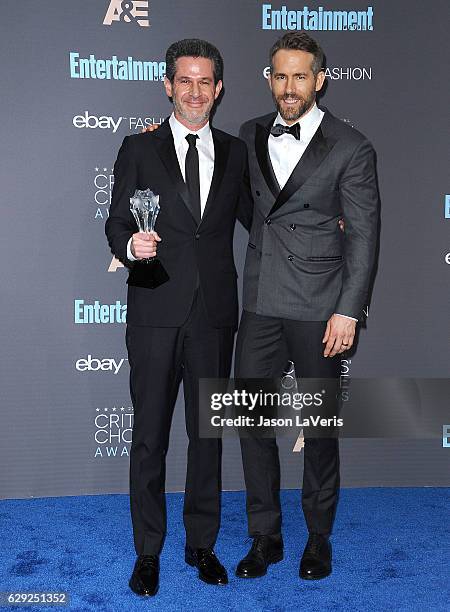 Producer Simon Kinberg and actor Ryan Reynolds pose in the press room at the 22nd annual Critics' Choice Awards at Barker Hangar on December 11, 2016...