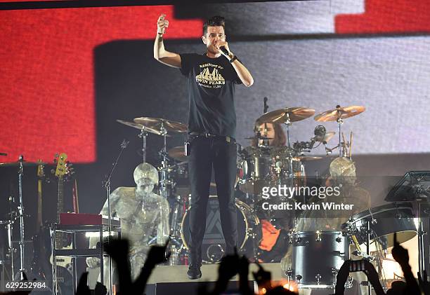 Dan Smith and drummer Chris Wood of the band Bastille perform onstage at 106.7 KROQ Almost Acoustic Christmas 2016 - Night 2 at The Forum on December...