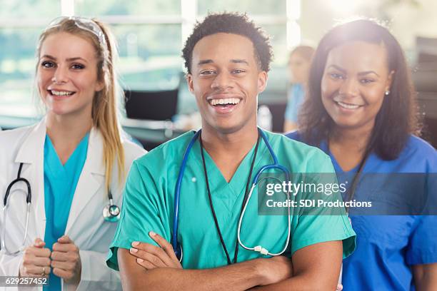 cheerful diverse group of medial students - male medical student stock pictures, royalty-free photos & images