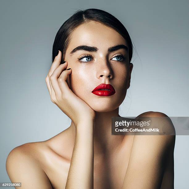 studio shot of young beautiful woman - menselijke lippen stockfoto's en -beelden