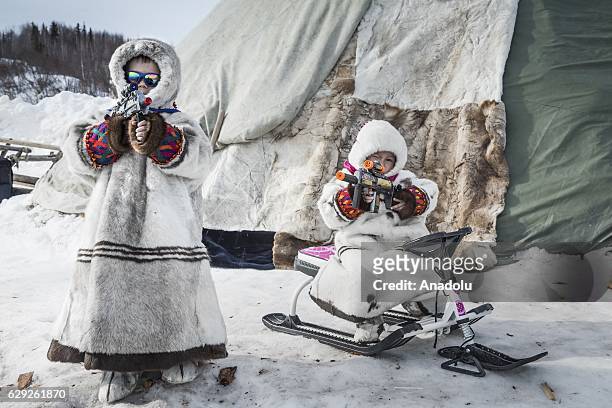 Kids are seen before the race on the Reindeer Herders Day in the village of Aksarka in the center Priuralsky district of Yamalo-Nenets Autonomous...
