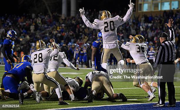 Westfields Yaylor Morin jumps with joy after Oscar Smith was stopped on the final down of overtime during Westfields defeat of Oscar Smith 34 - 28 in...