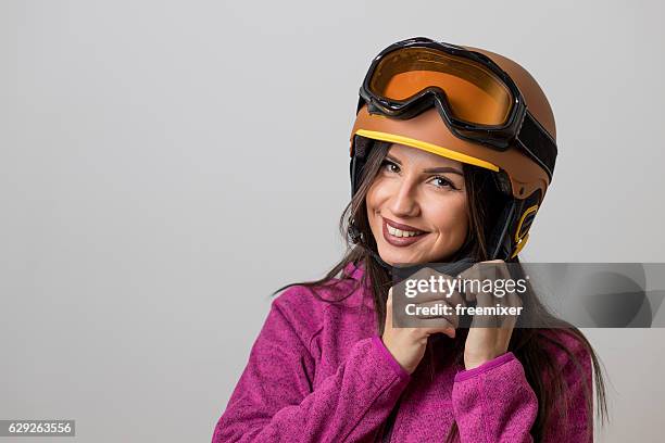 getting ready with new equipment - skiing helmet imagens e fotografias de stock