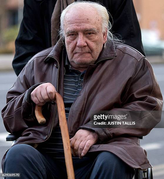 Soviet-era dissident Vladimir Bukovsky is pushed in a wheelchair as he arrives at Cambridge Crown Court in Cambridge, east England, on December 12,...