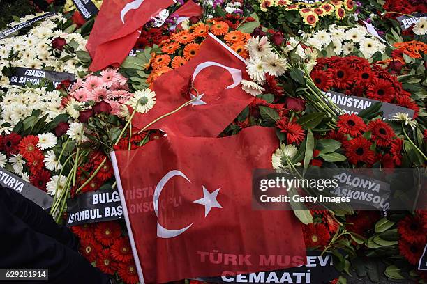 Wreaths, placed by representatives of foreign missions, are pictured at the scene of Saturday's blasts in Istanbul, December 12 Turkey. At least 44...