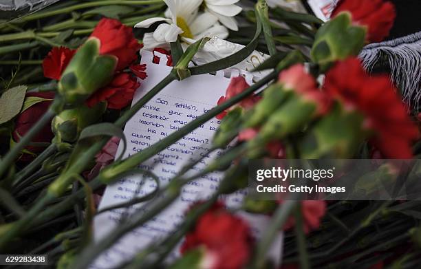 Wreaths, placed by representatives of foreign missions, are pictured at the scene of Saturday's blasts in Istanbul, December 12 Turkey. At least 44...