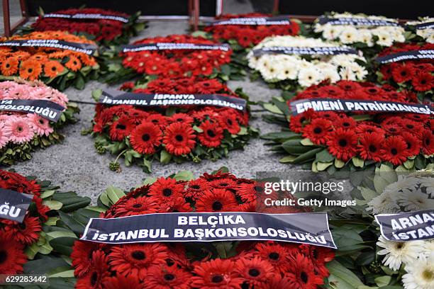 Wreaths, placed by representatives of foreign missions, are pictured at the scene of Saturday's blasts in Istanbul, December 12 Turkey. At least 44...