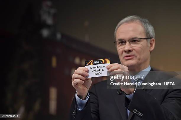 Deputy General Secretary Giorgio Marchetti draws out the name of Manchester United during the UEFA Europa League 2016/17 Round of 32 Draw at the UEFA...