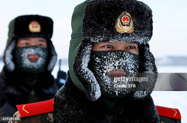 Chinese paramilitary police border guards train in the snow at Mohe County in China's northeast Heilongjiang province, on the border with Russia, on...