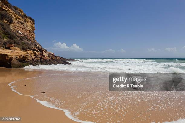 beach in portugal, atlantic ocean - burgau portugal stock pictures, royalty-free photos & images