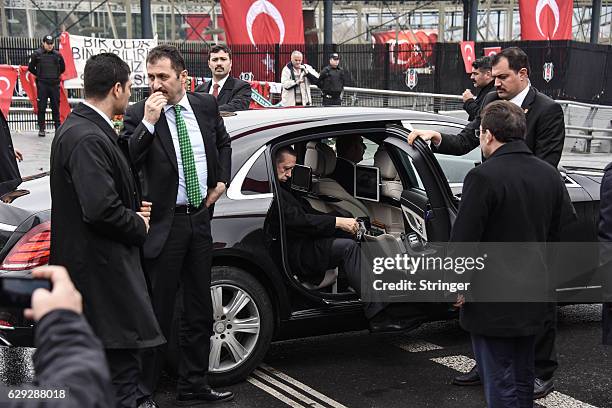 Turkish President Recep Tayyip Erdogan leaves his motocade during his visit the blast site outside the Besiktas FC's Vodafone Arena Stadium on...