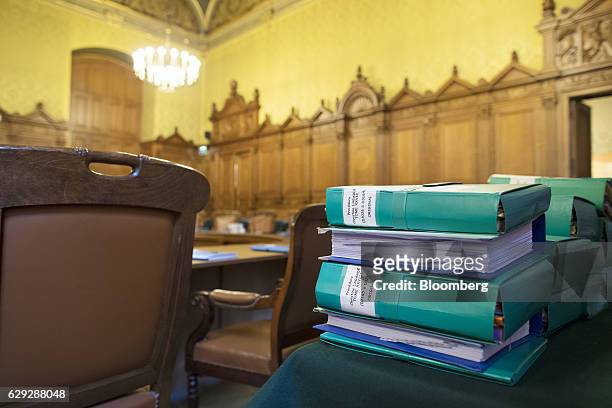 Coloured document folders, marked with the name of Christine Lagarde, managing director of the International Monetary Fund , sit on a desk inside the...