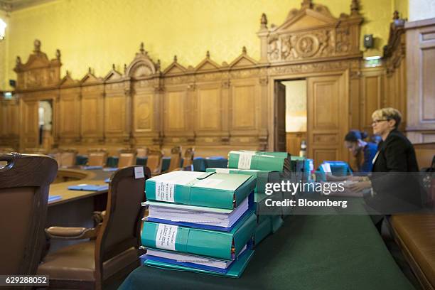 Coloured document folders, marked with the name of Christine Lagarde, managing director of the International Monetary Fund , sit on a desk inside the...