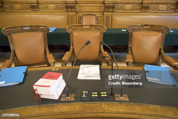 Legal reference books sit on desks at the seating area for judges and lawmakers conducting the trial of Christine Lagarde, managing director of the...
