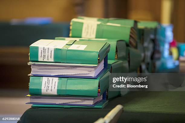 Coloured document folders, marked with the name of Christine Lagarde, managing director of the International Monetary Fund , sit on a desk inside the...