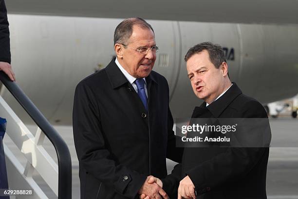 Russian Foreign Minister Sergey Lavrov is welcomed by his Serbian counterpart Ivica Dacic upon his arrival at Belgrade Nikola Tesla Airport in...