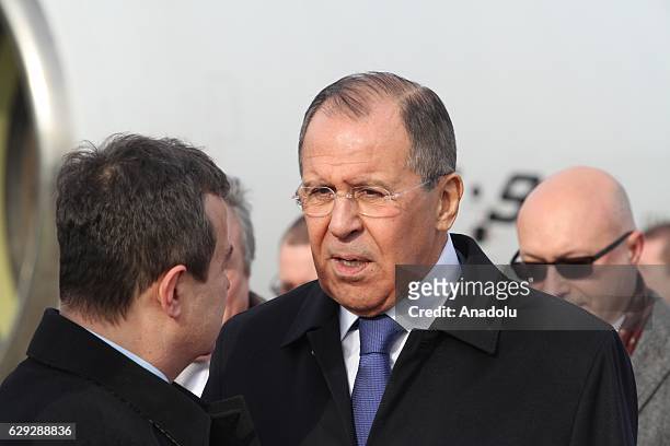 Russian Foreign Minister Sergey Lavrov is welcomed by his Serbian counterpart Ivica Dacic upon his arrival at Belgrade Nikola Tesla Airport in...