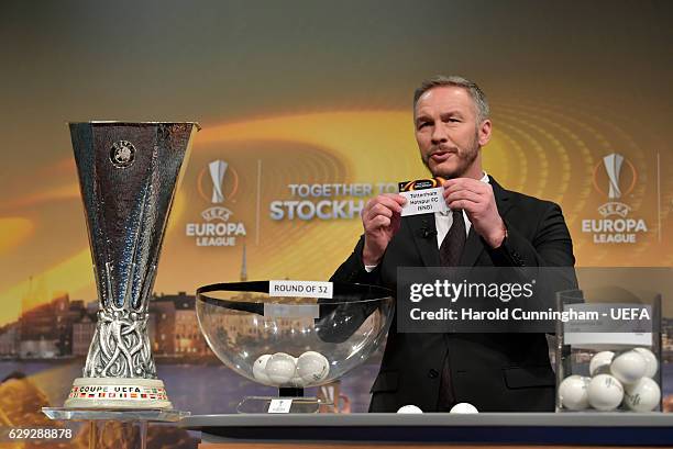 Europa League Ambassador Patrik Andersson draws out the name of Tottenham Hotspur during the UEFA Europa League 2016/17 Round of 32 Draw at the UEFA...