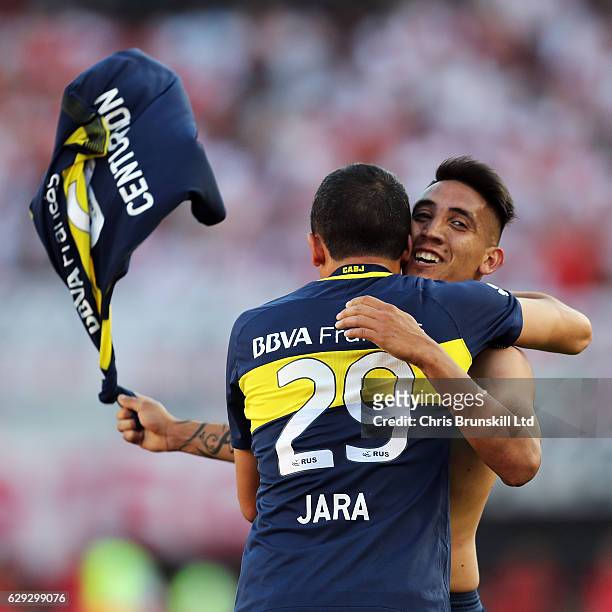 Ricardo Centurion of Boca Juniors celebrates scoring his sides fourth goal with team-mate Leonardo Jara during the Argentine Primera Division match...