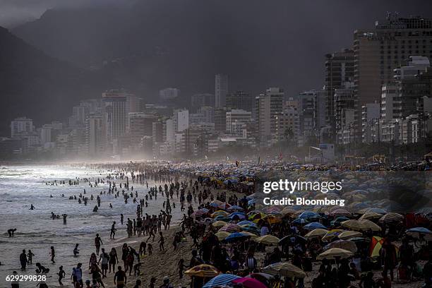 Bloomberg Best of the Year 2016: Thousands gather on Ipanema Beach in Rio de Janeiro, Brazil, on Tuesday, Jan. 5, 2016. A strong U.S. Dollar, lower...