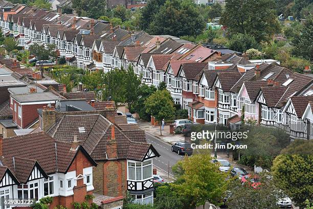 View of suburban housing along a street in Ealing on September 17, 2016 in London, England. Ealing is popularly known as 'Queen of the Suburbs'.