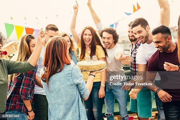 30th birthday party - man giving cake candle stock pictures, royalty-free photos & images