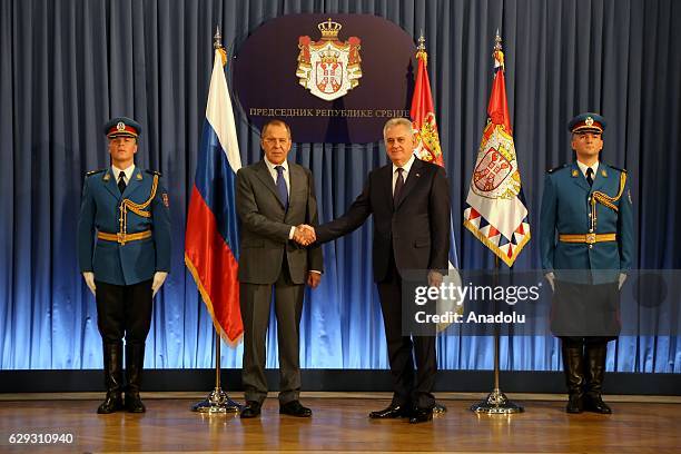 Serbia's President Tomislav Nikolic and Russia's Foreign Minister Sergei Lavrov shake hands during award ceremony of 1st Class Order of the Serbian...