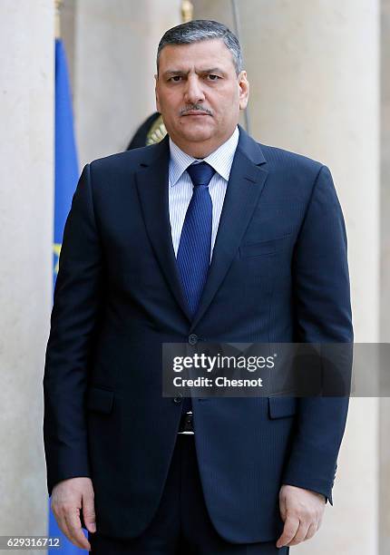 Riad Hijab, chief coordinator of the Syrian opposition's High Negotiations Committee poses as he arrives prior to a meeting with French President...