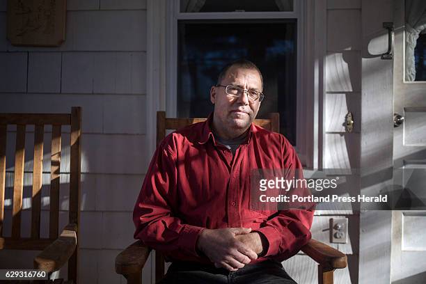 Tony Verdelli poses for a portrait on his back porch in South Portland. Verdelli is a nurse at Maine Medical, where he met Michele Breault who was...