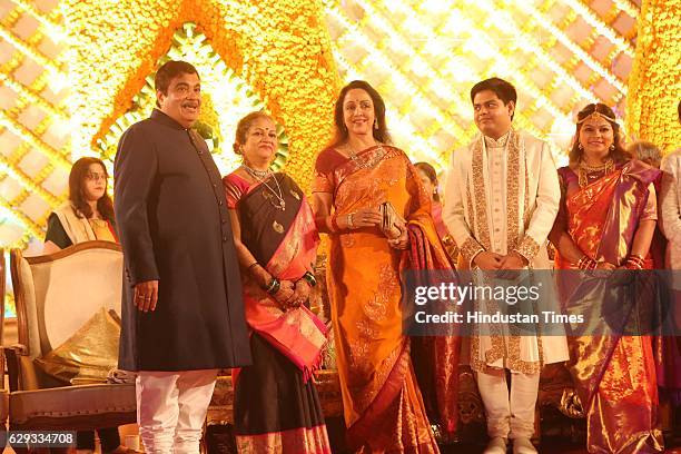 Bollywood actor Hema Malini poses with Union Minister Nitin Gadkari, his wife Kanchan Gadkari and their newlywed daughter Ketki and son-in-law Aditya...