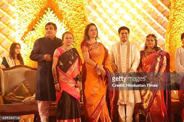 Bollywood actor Hema Malini poses with Union Minister Nitin Gadkari, his wife Kanchan Gadkari and their newlywed daughter Ketki and son-in-law Aditya...