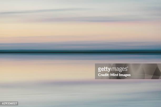the view across the flooded salt flats at dawn at bonneville salt flats in utah - view into land stock pictures, royalty-free photos & images