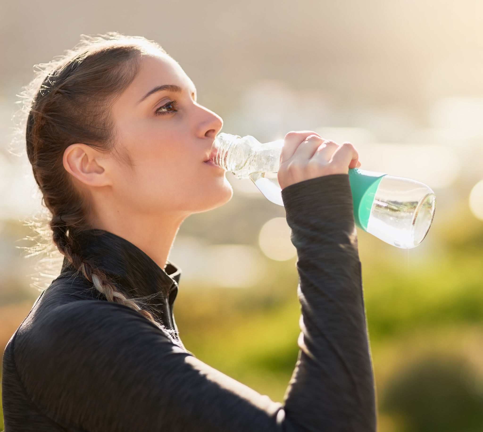 a woman staying hydrated a woman staying hydrated