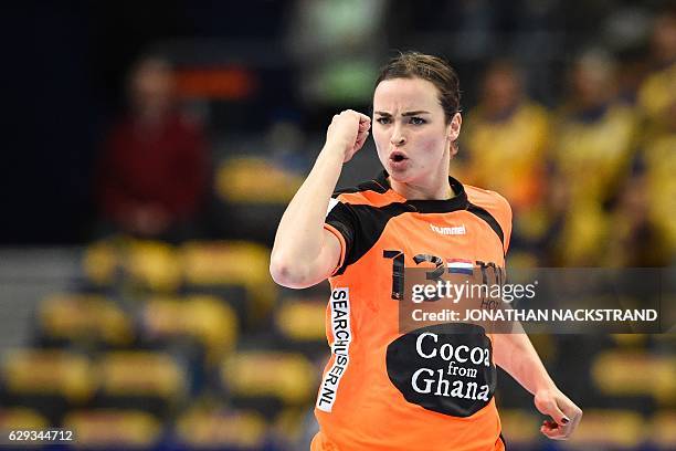 Netherlands' Yvette Broch celebrates after scoring a goal during the Women's European Handball Championship Group I match between Serbia and...