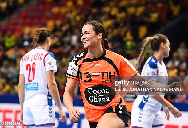 Netherlands' Yvette Broch celebrates after scoring a goal during the Women's European Handball Championship Group I match between Serbia and...