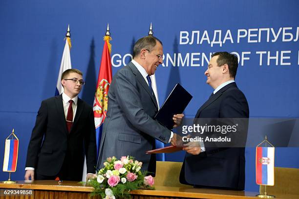 Russia's Foreign Minister Sergei Lavrov and his Serbian counterpart Ivica Dacic attend bilateral agreement signature ceremony after their meeting in...