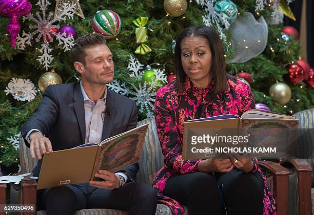 First Lady Michelle Obama and television personality Ryan Seacrest read "Twas The Night Before Christmas" to children at the Children's National...