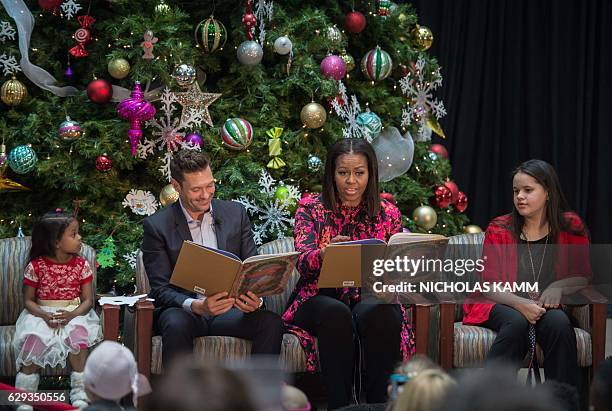 First Lady Michelle Obama and television personality Ryan Seacrest read "Twas The Night Before Christmas" to children at the Children's National...