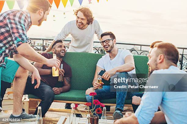 group of young men drinking beer - stag stock pictures, royalty-free photos & images