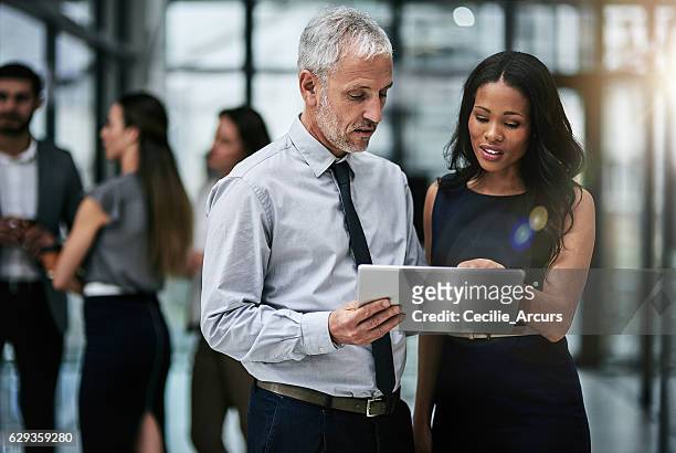 teamwork and technology, indispensable tools for corporate productivity - business finance and industry stock pictures, royalty-free photos & images