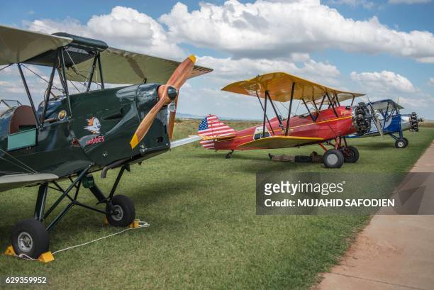 Picture taken on December 12, 2016 shows aircrafts after they landed at Baragwanath airfield as part of the Vintage Air Rally airshow. - A dozen...