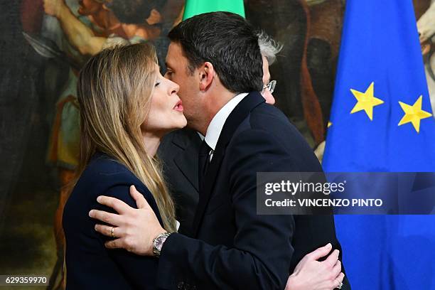 Former Prime Minister Matteo Renzi kisses Undersecretary to the Prime Minister Maria Elena Boschi before to leave after the swearing in ceremony of...