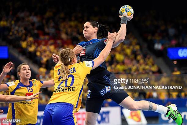 Sweden's Isabelle Gullden stops France's Alexandra Lacrabere as she prepares to throw the ball during the Women's European Handball Championship...