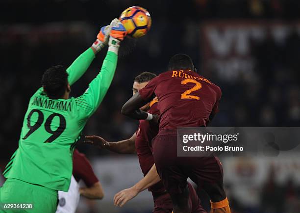 Milan goalkeeper Gianluigi Donnarumma competes for the ball with Antonio Rudiger of AS Roma during the Serie A match between AS Roma and AC Milan at...