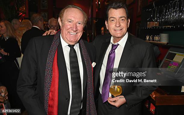 Andrew Neil and Charlie Sheen attend the Snow Queen Cigar Smoker of the Year awards at Boisdale of Canary Wharf on December 12, 2016 in London,...