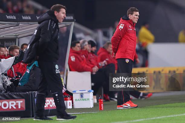 Head coaches Hannes Wolf of Stuttgart and Daniel Stendel of Hannover react during the Second Bundesliga match between VfB Stuttgart and Hannover 96...