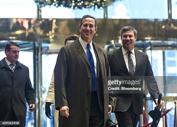 Rick Santorum, former senator from Pennsylvania, center, arrives at Trump Tower in New York, U.S., on Monday, Dec. 12, 2016. Senate Majority Leader...