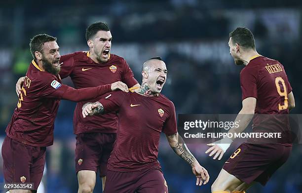 Roma's midfielder from Belgium Radja Nianggolan celebrates after scoring during the Italian Serie A football match Roma vs AC Milan at the Olympic...