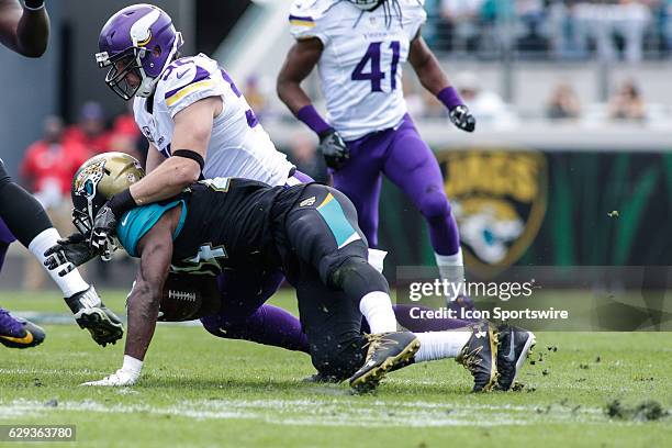 Minnesota Vikings Linebacker Chad Greenway tackles Jacksonville Jaguars Running Back T.J. Yeldon during the NFL game between the Minnesota Vikings...