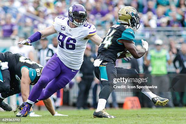 Minnesota Vikings Defensive End Brian Robison attempts to tackle Jacksonville Jaguars Running Back T.J. Yeldon during the NFL game between the...